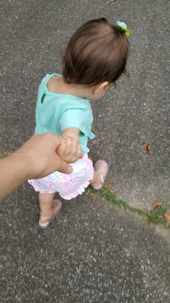 Mama Rissa's daughter pulling her hand to go play. 