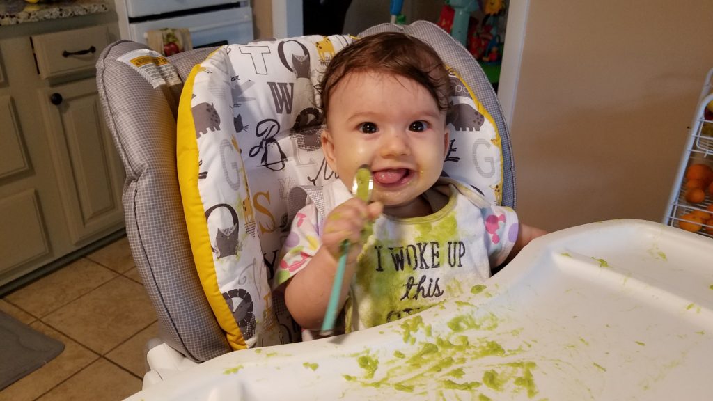 Mana Rissa's baby eating avocado, showing how to start solids with a baby.