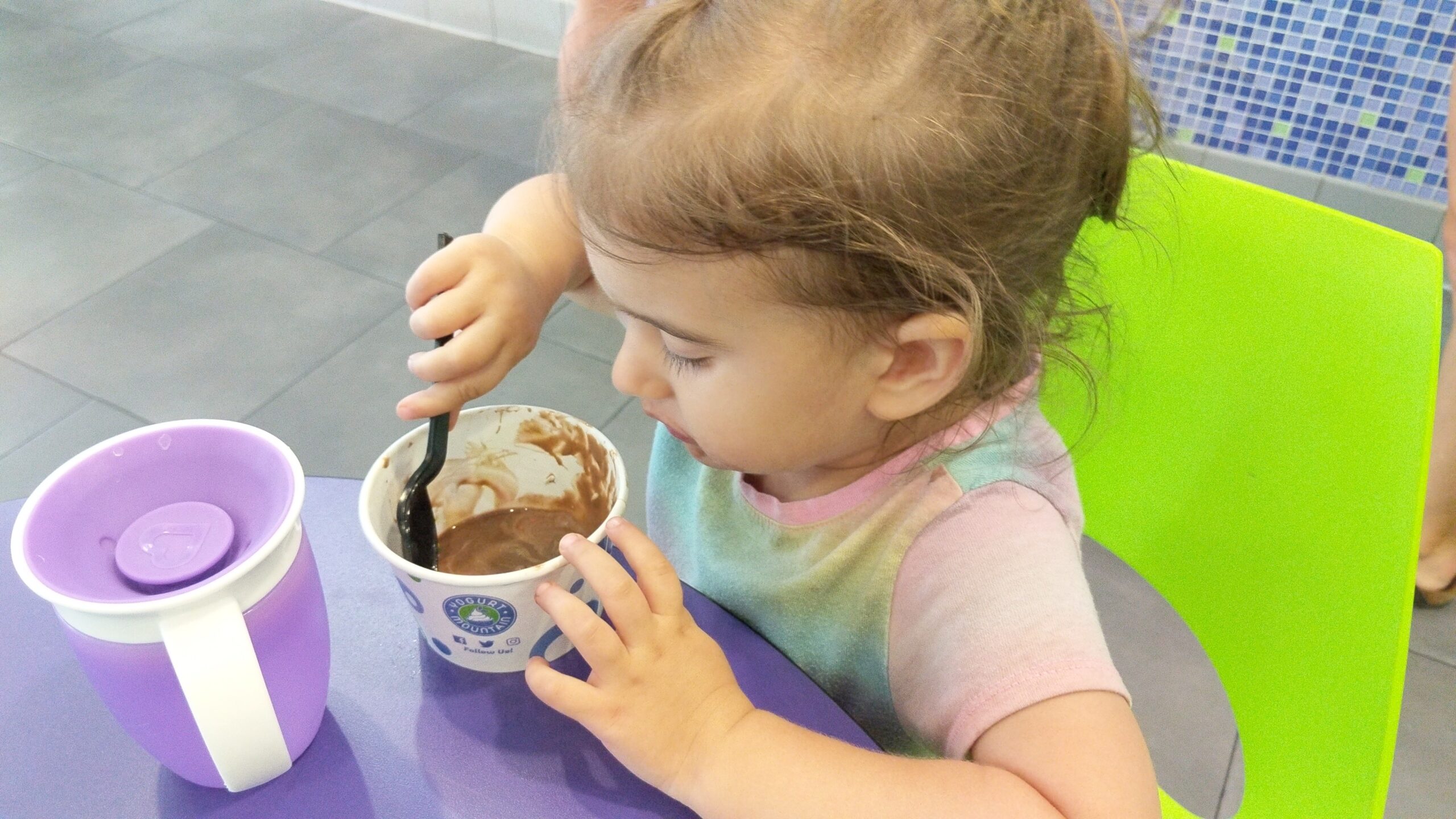 Mama Rissa's daughter eating ice cream.