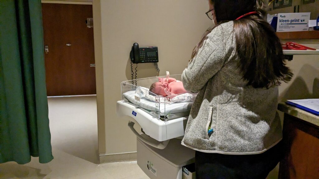 Mama RIssa's baby with the nurse.