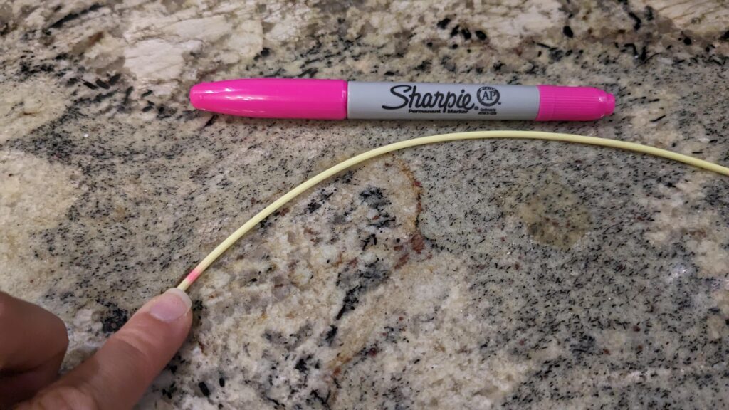 Baby NG tube marked with a Sharpie