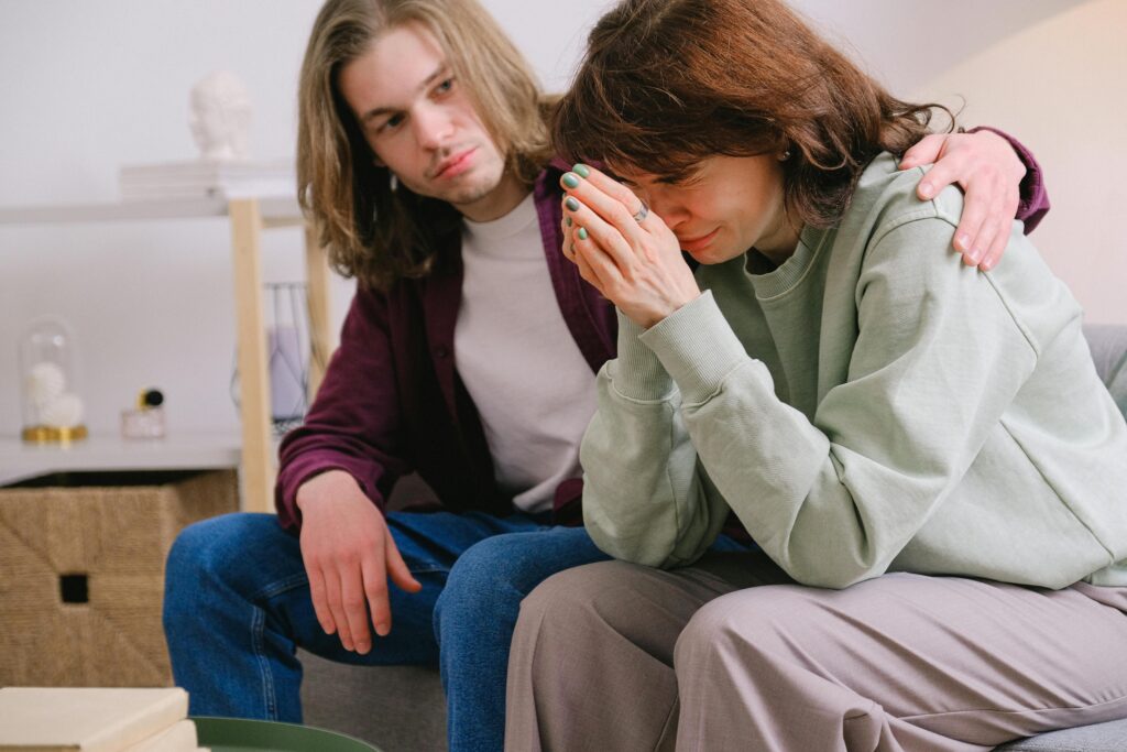 Man comforting a crying woman