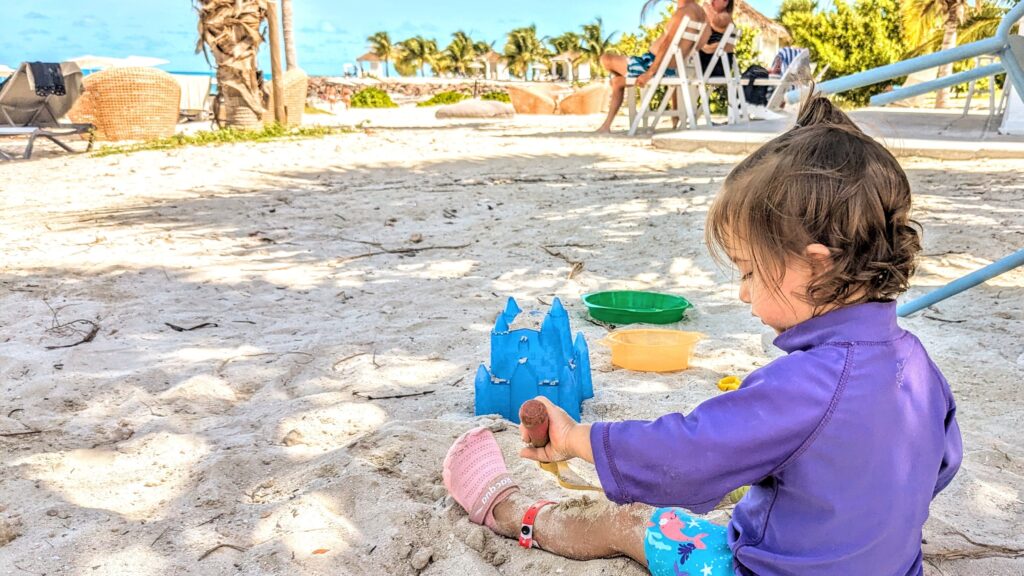 Mama Rissa's daughter playing on the beach