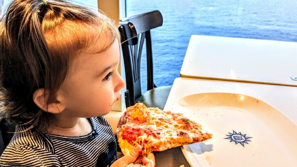 Mama Rissa's daughter eating pizza